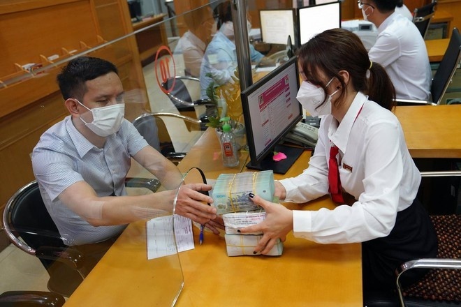 Tin ngân hàng tuần qua: Ngân hàng Nhà nước dừng thi hành quy định kiểm soát cho vay vốn